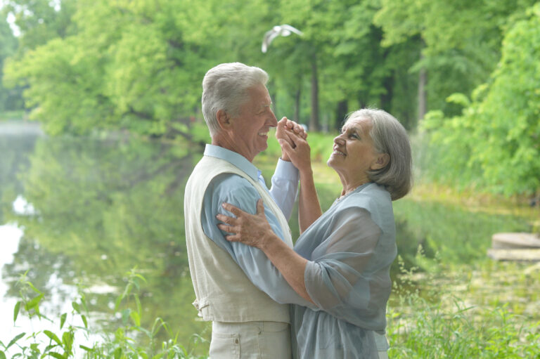 Mature couple  dancing in summer park